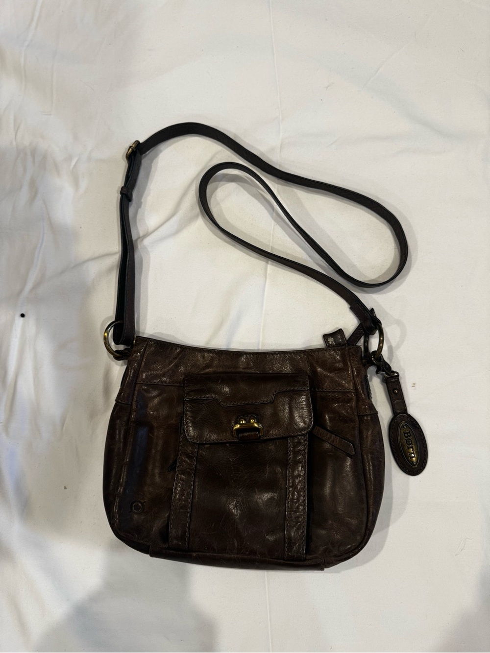 Born Brown Leather Crossbody Bag with Front Pocket and Brass Detail